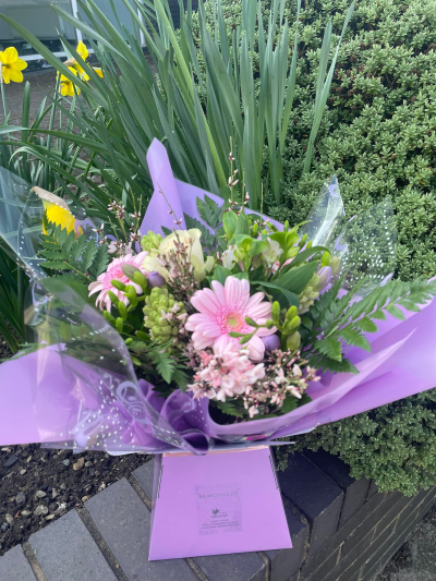 Ashleigh - A budding delight, complimented by greenery and presented in a gift box/bag. Beautiful flower bouquet hand delivered by the local florist.